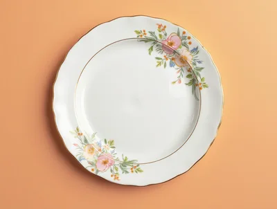 Elegant Floral Porcelain Dinner Plate on Peach Background