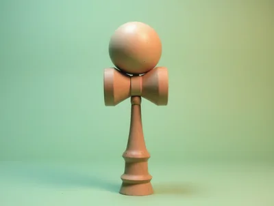 Wooden Kendama Toy Standing On A Pastel Background
