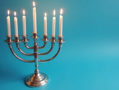 Silver Menorah With Seven Lit Candles