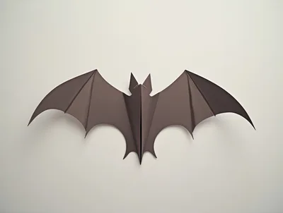 Origami Paper Bat On A Plain Background