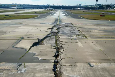 Damaged Airport Runway With Deep Concrete Cracks