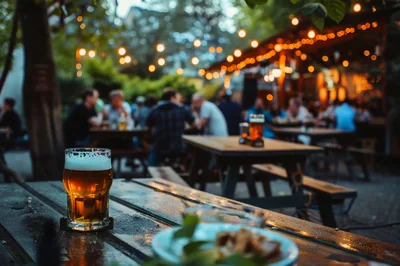 Beer Glass On Outdoor Pub Table At Dusk