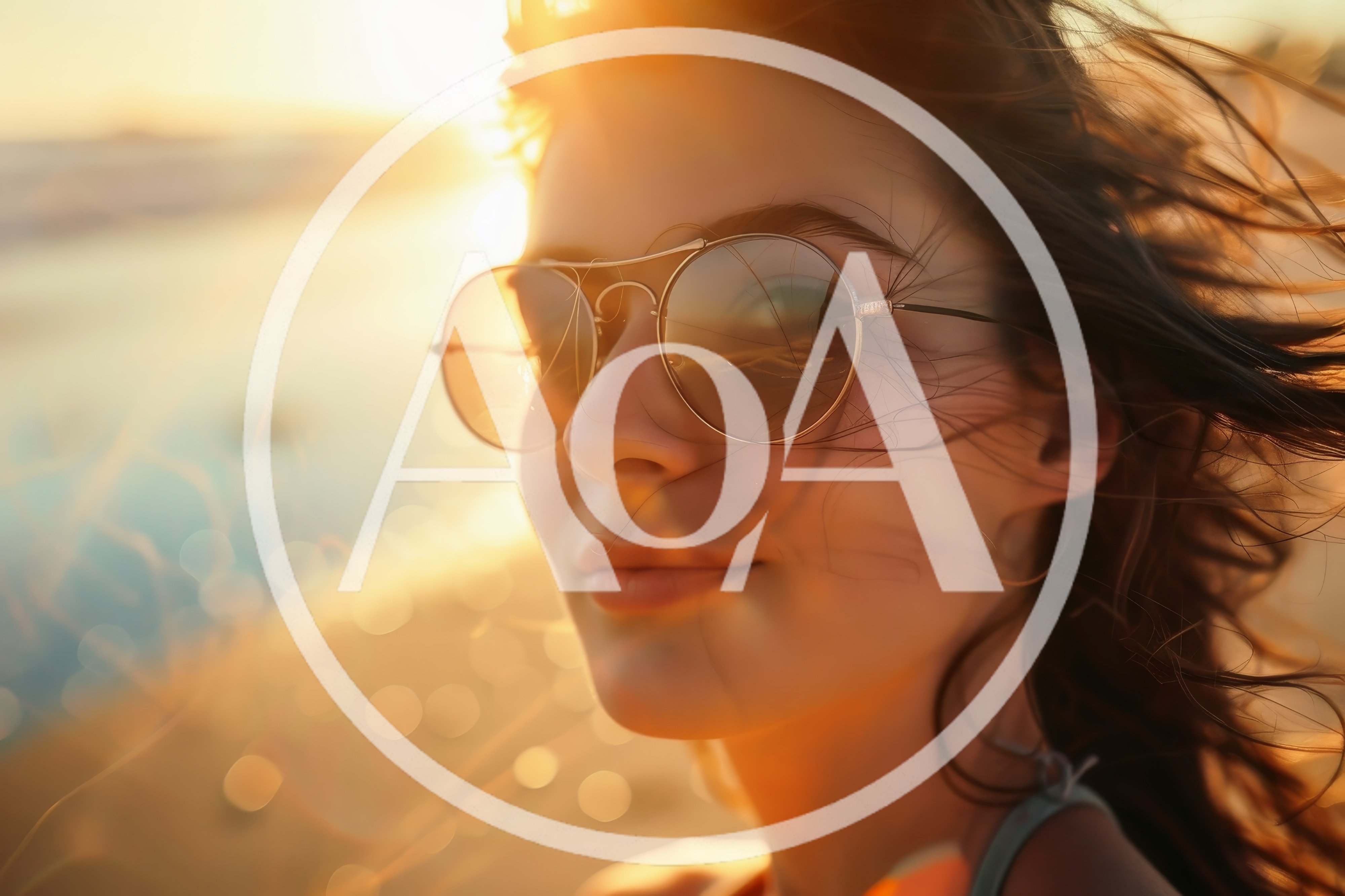 Young Woman Wearing Sunglasses At Sunset Beach