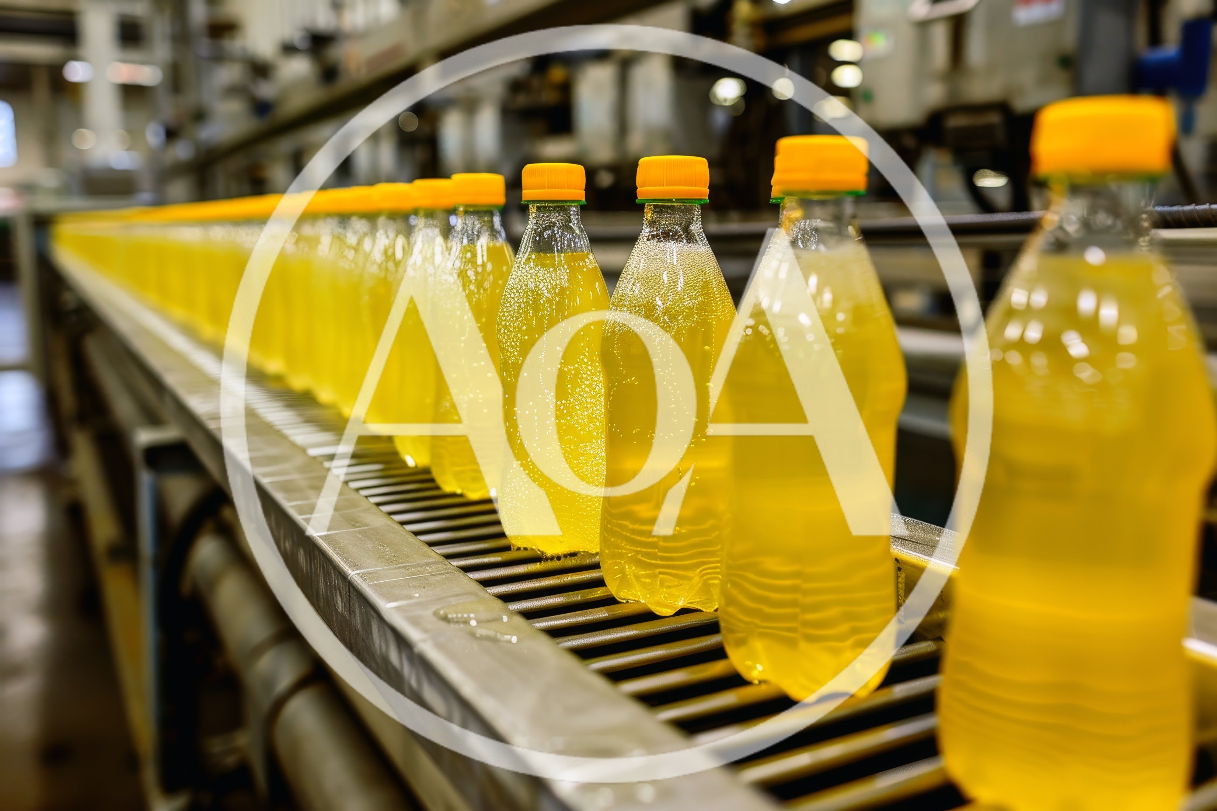 Yellow Soda Bottles Moving Along Industrial Conveyor Belt