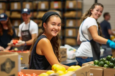 Young Volunteers Sorting Fresh Produce In A Food Bank