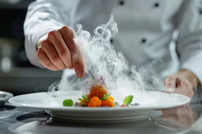 Professional Chef Plating Gourmet Dish With Dry Ice Smoke