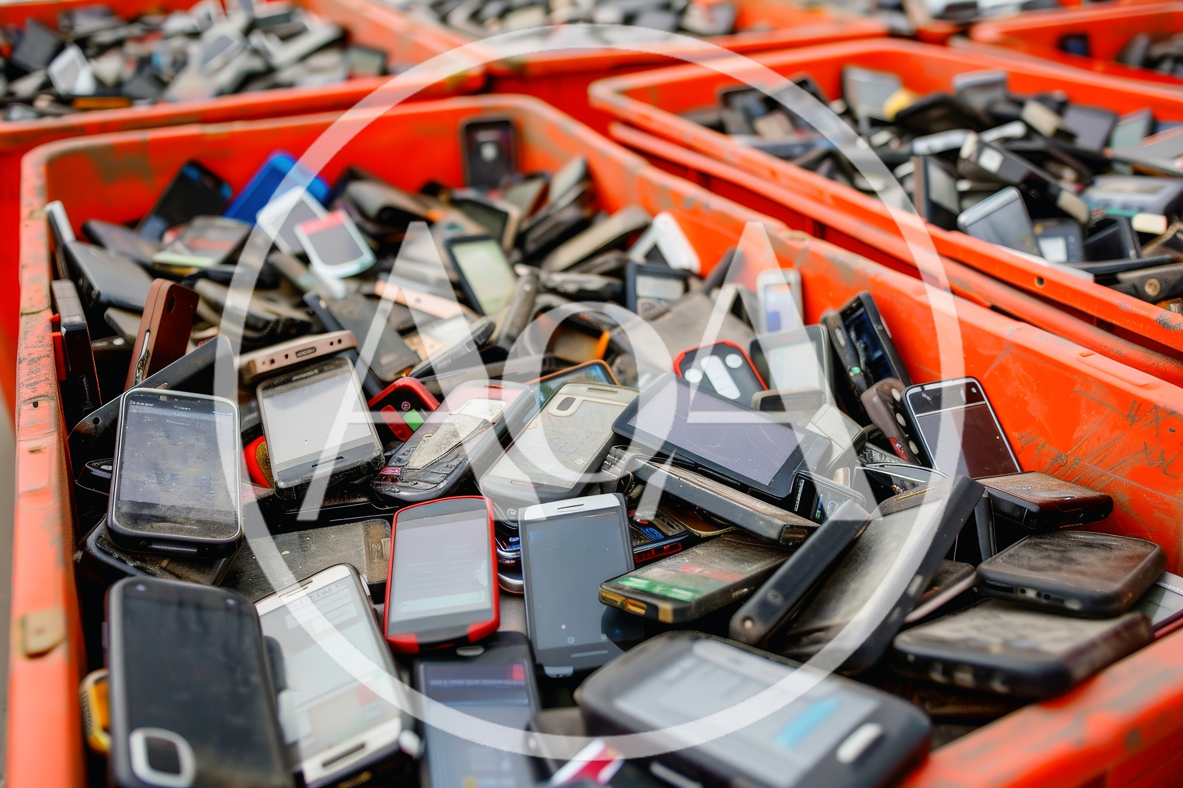 Pile of Discarded Used Mobile Phones in Plastic Bins