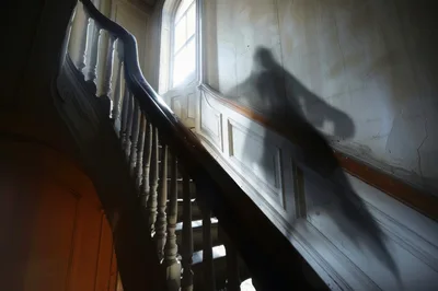 Shadow Of A Mysterious Figure On A Staircase