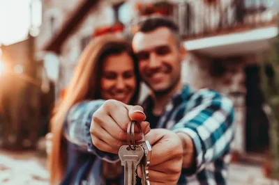Happy Couple Holding New House Keys