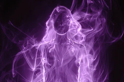 Ethereal Woman Silhouette Formed From Swirling Purple Smoke