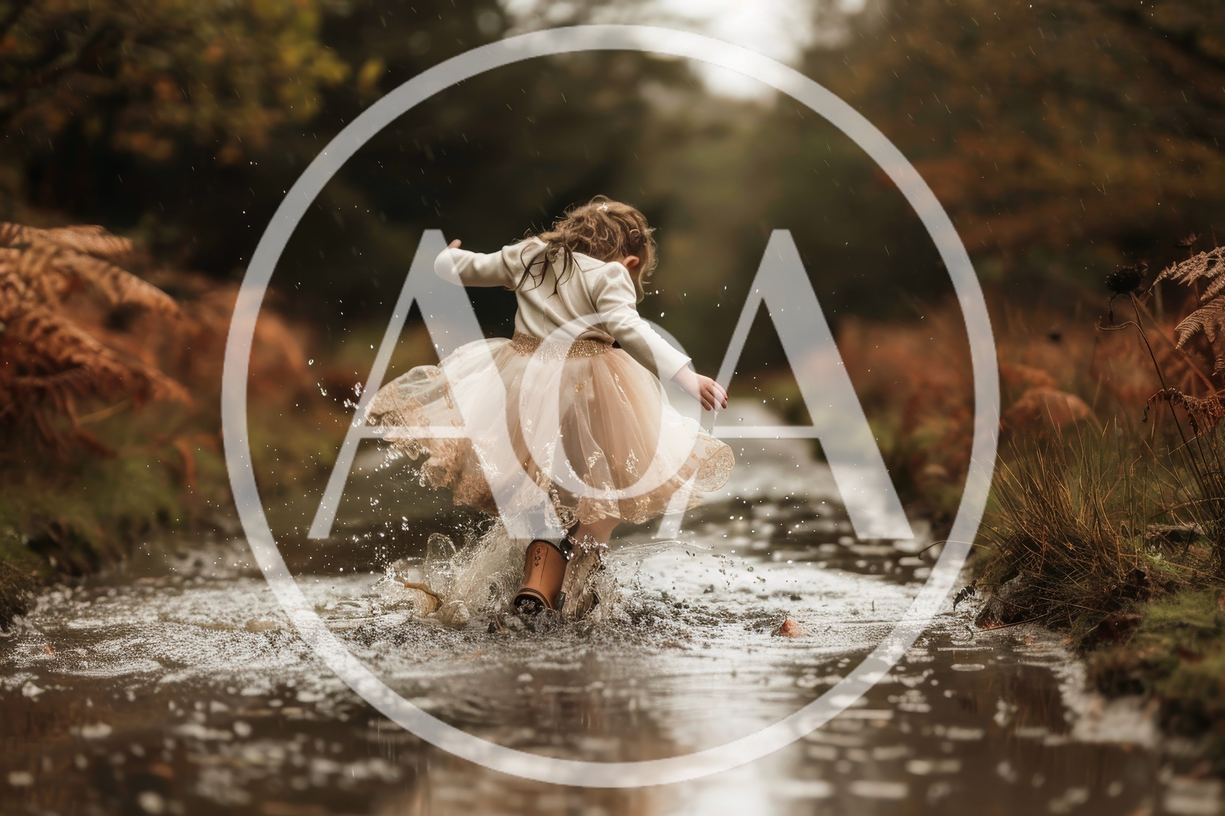 A little girl jumps into a puddle in her beautiful dress and wel