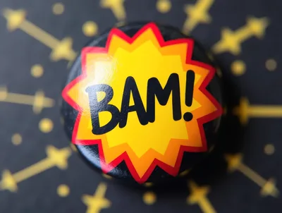 Comic Book Style Bam Button On Patterned Background