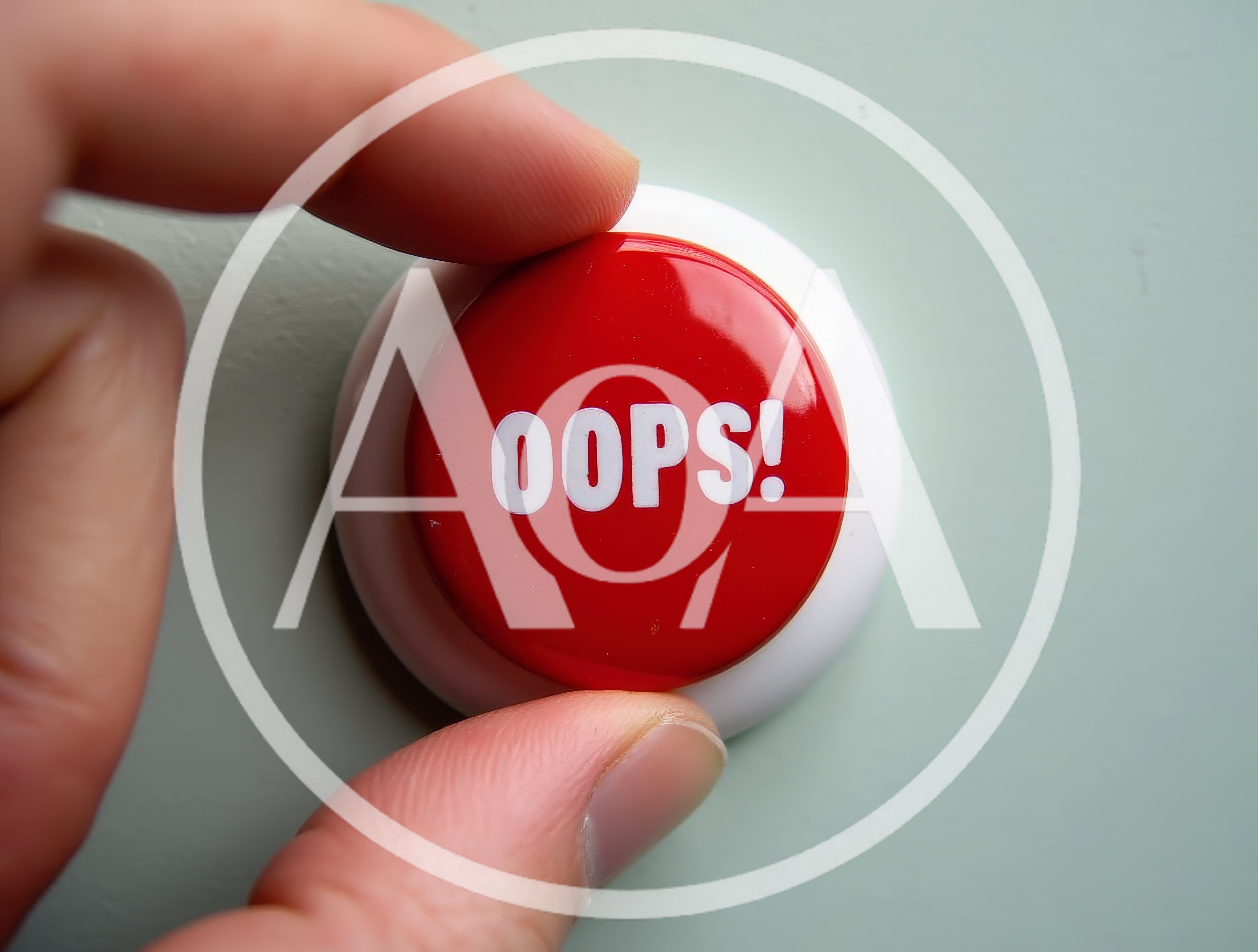 Hand Pressing A Red Oops Button