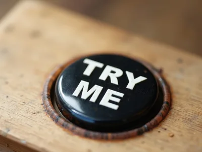 Black Try Me Button Set In A Wooden Surface