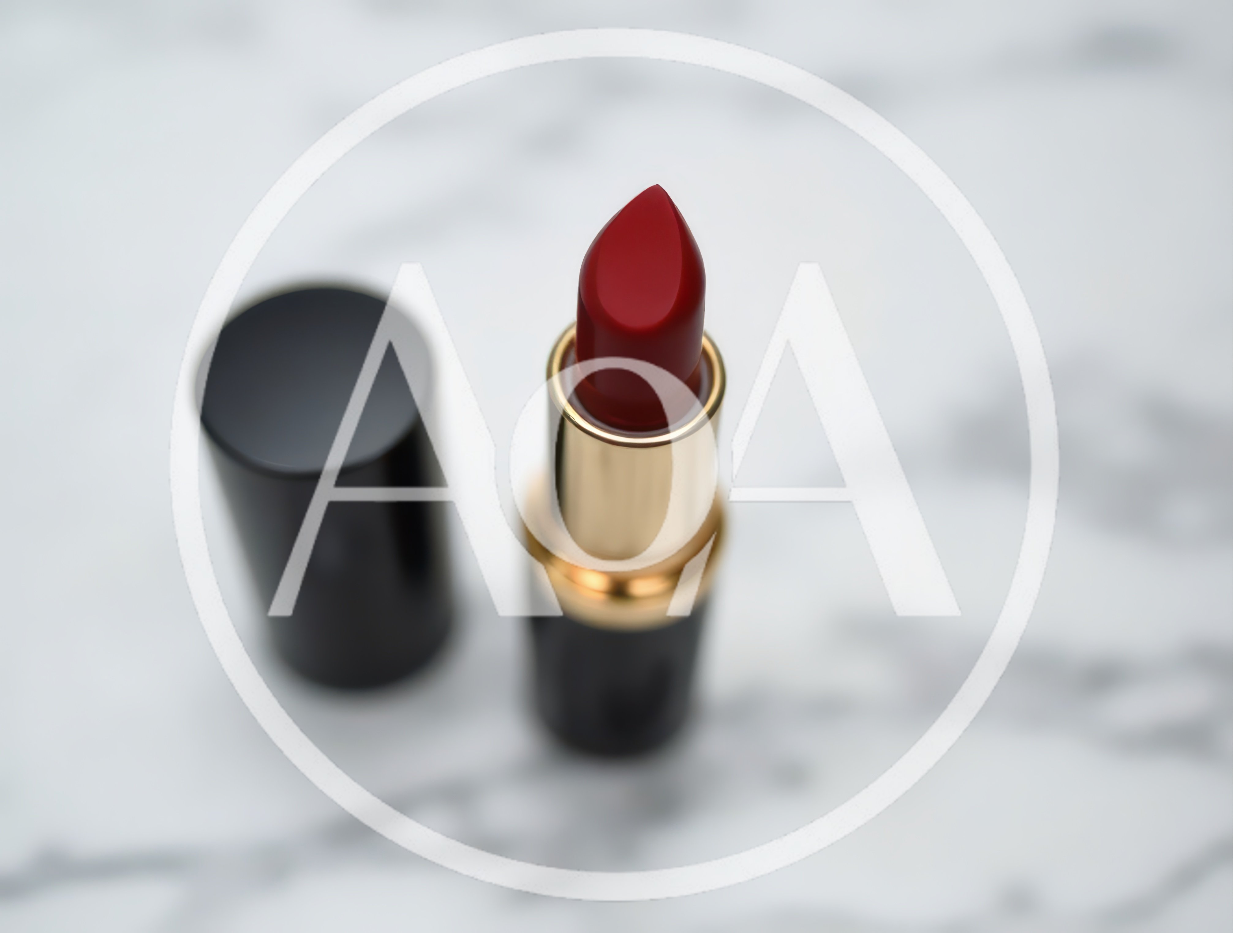 Red Lipstick With Cap On Marble Surface