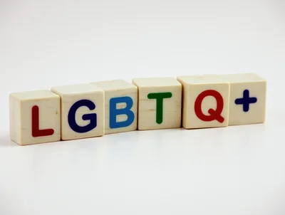 Wooden Alphabet Blocks Spelling LGBTQ Plus