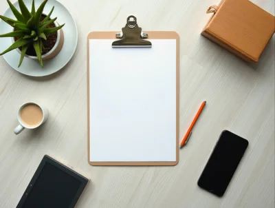 Top View Of Office Desk With Clipboard And Accessories