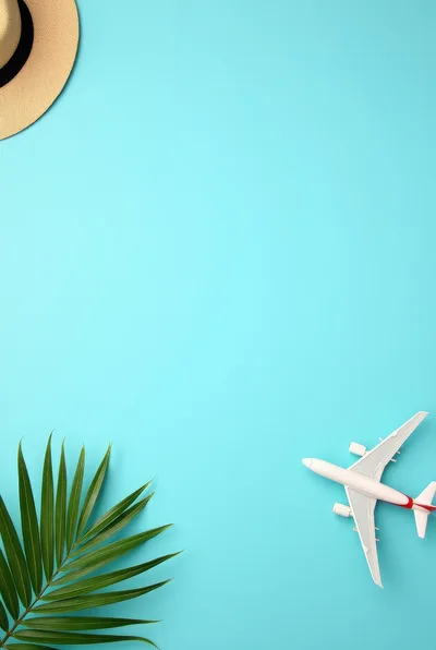 Travel Concept with Airplane Model and Palm Leaf