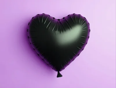 Black Heart Shaped Balloon on Purple Background