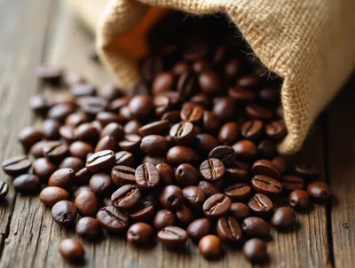 Roasted Coffee Beans Spilling From A Burlap Sack