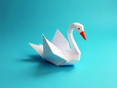 White Origami Swan On A Blue Background
