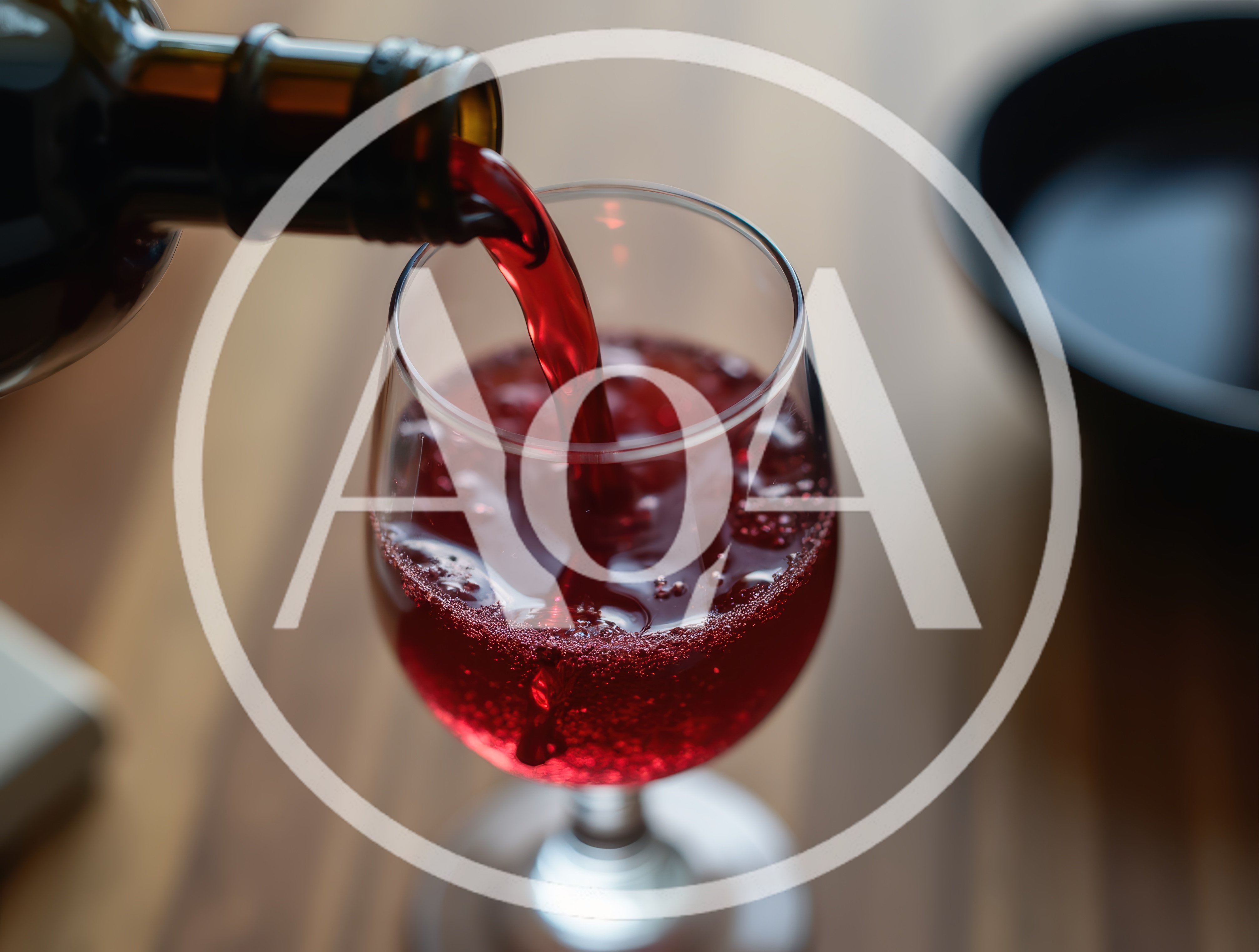 Red Wine Being Poured Into A Glass
