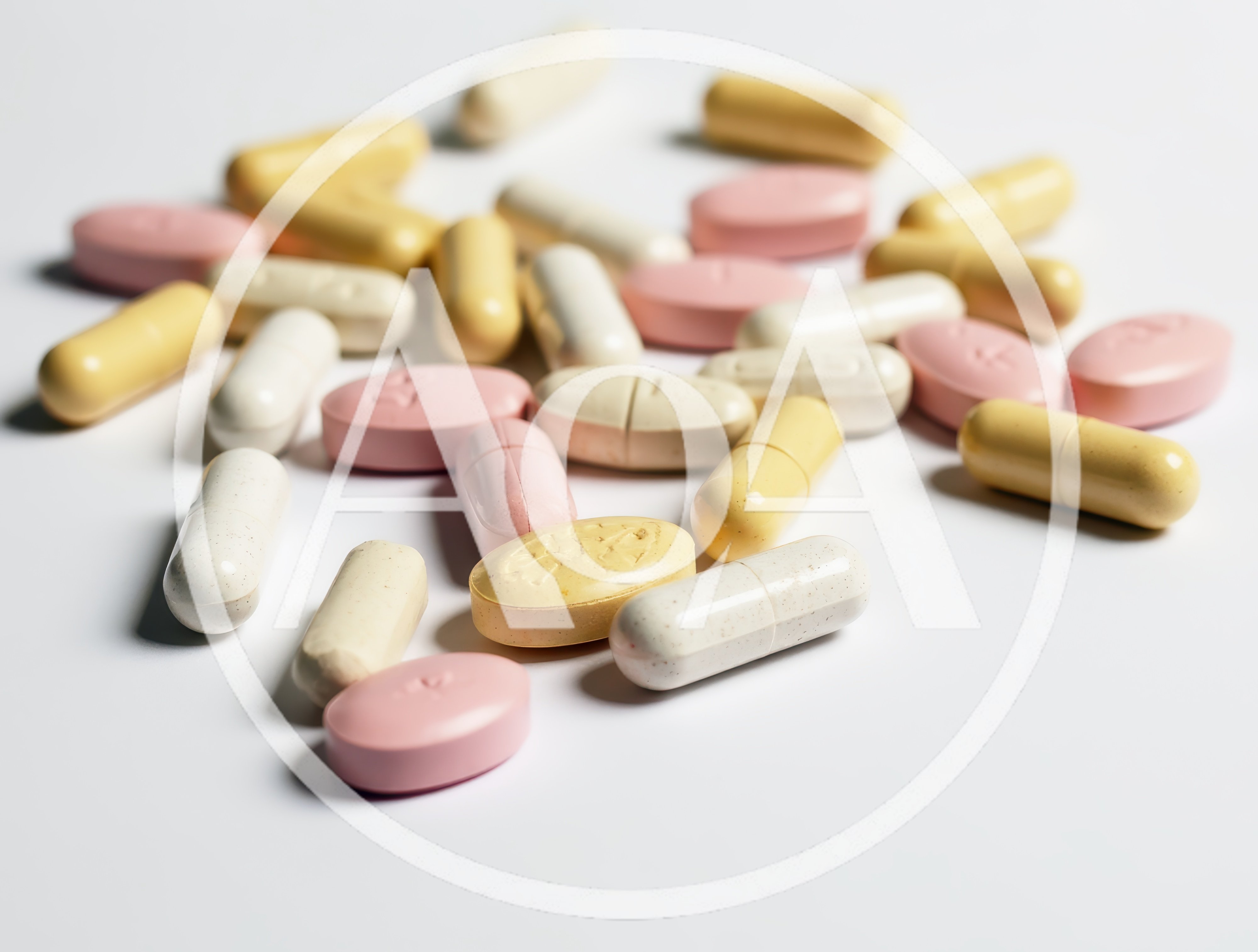 Assorted Pharmaceutical Pills and Capsules on White Background