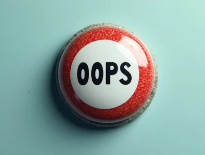 Red Oops Button On A Light Blue Background