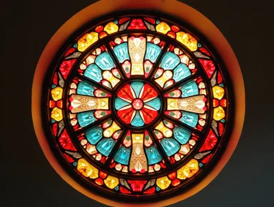Circular Stained Glass Window With Geometric Floral Pattern