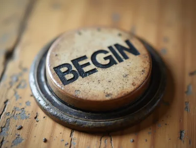Vintage Round Button With Begin Text On Wooden Surface