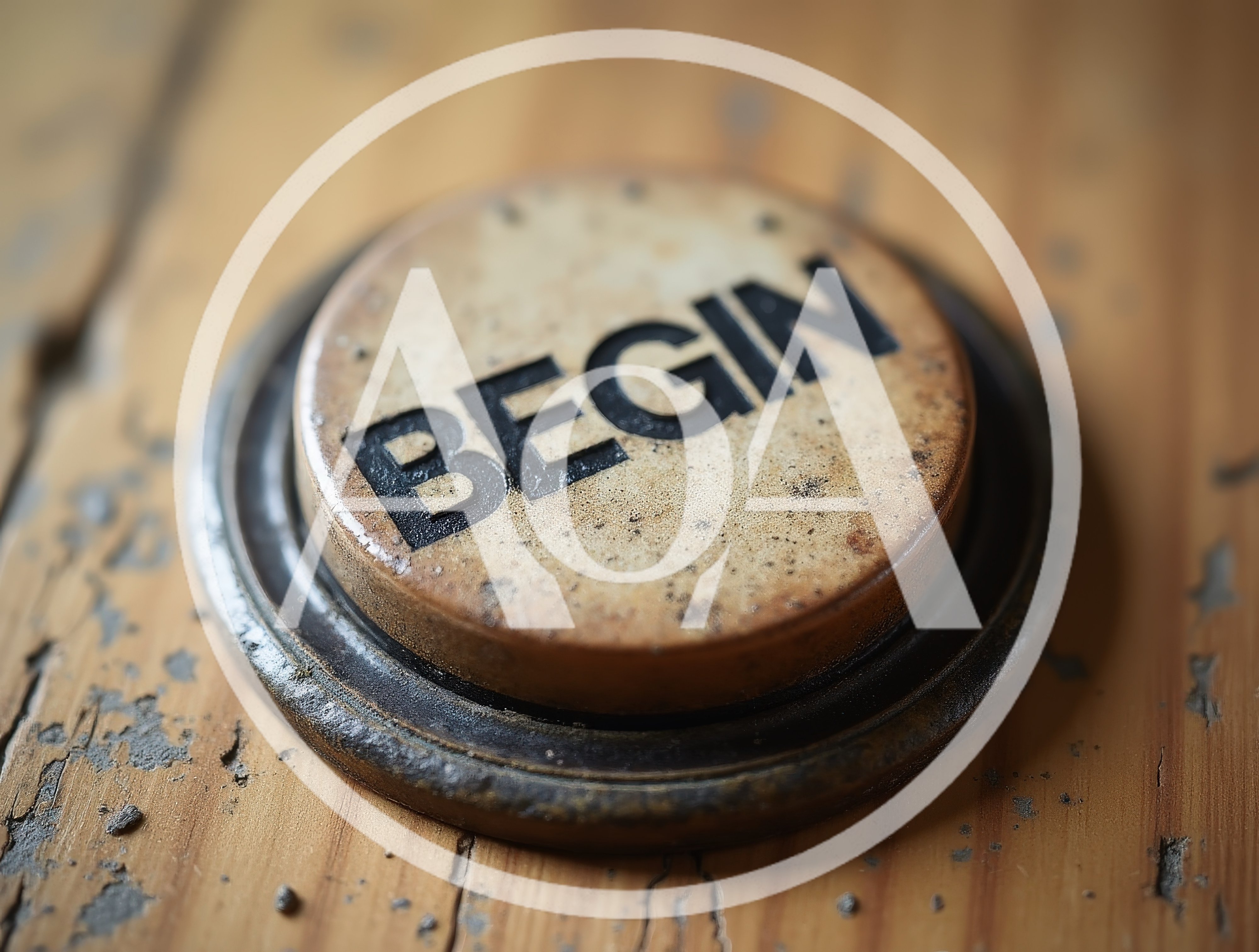 Vintage Round Button With Begin Text On Wooden Surface
