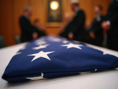 Folded American Flag Resting On A Table