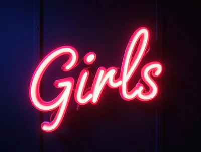 Neon Girls Sign Glowing On Dark Wall