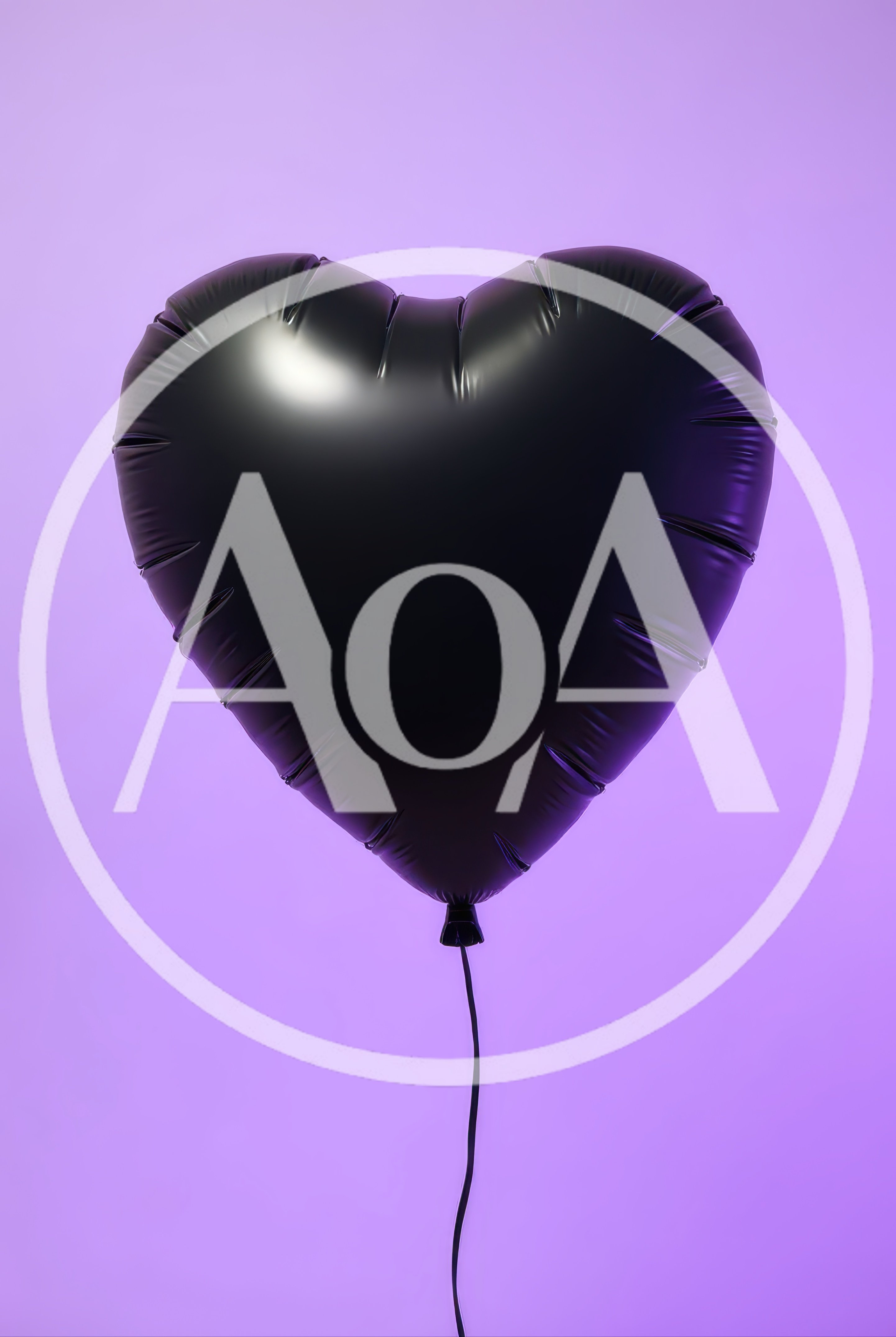 Black Heart Shaped Balloon Against Purple Background