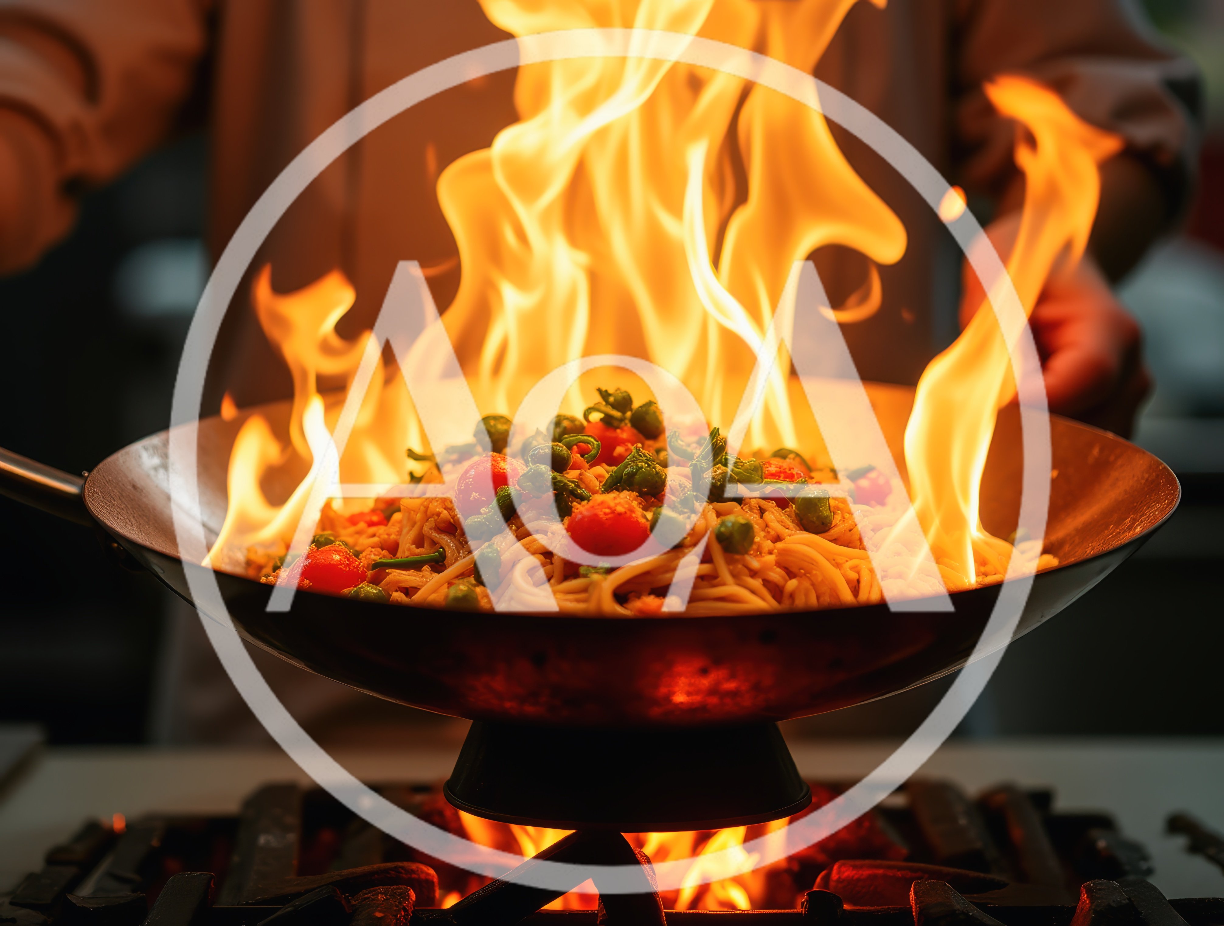 Chef Stir Frying Noodles In A Flaming Wok
