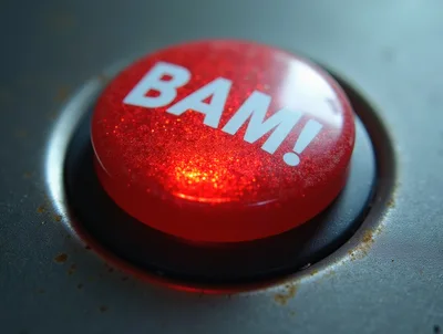 Red Glittery Button With BAM Text