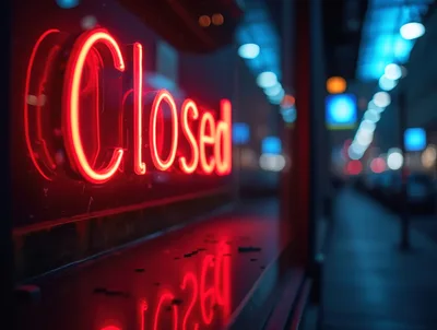 Red Neon Closed Sign In A Store Window