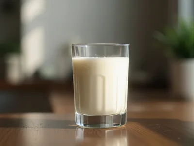 Glass Of Fresh Milk On A Wooden Table