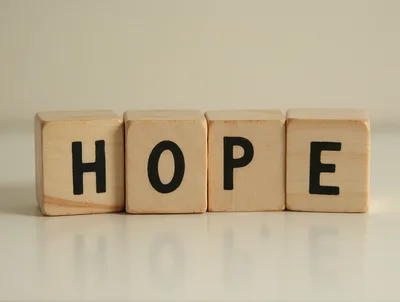 Wooden Blocks Spelling The Word Hope