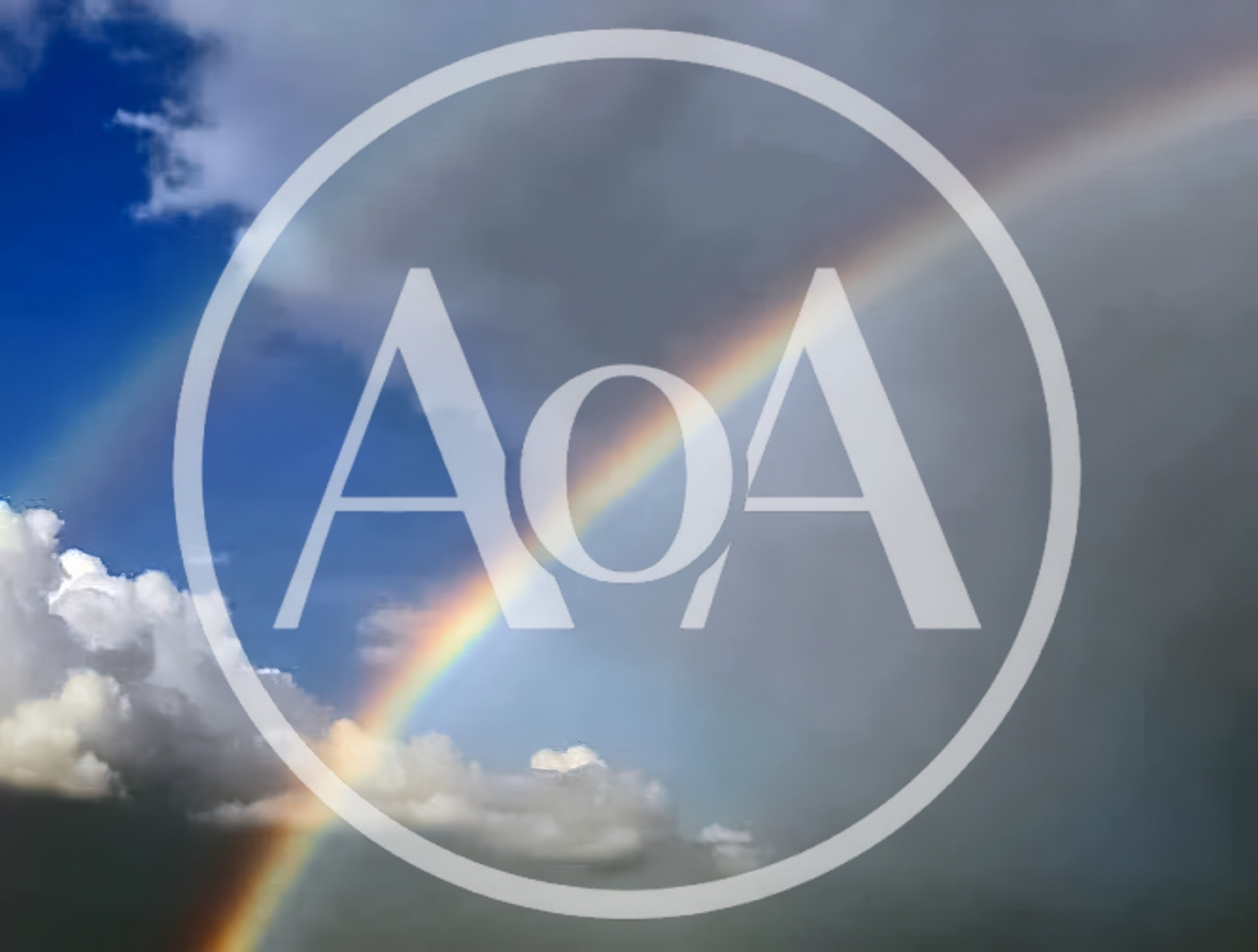 Double Rainbow Arching Across A Cloudy Blue Sky
