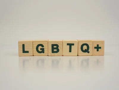 LGBTQ Plus Text On Wooden Blocks