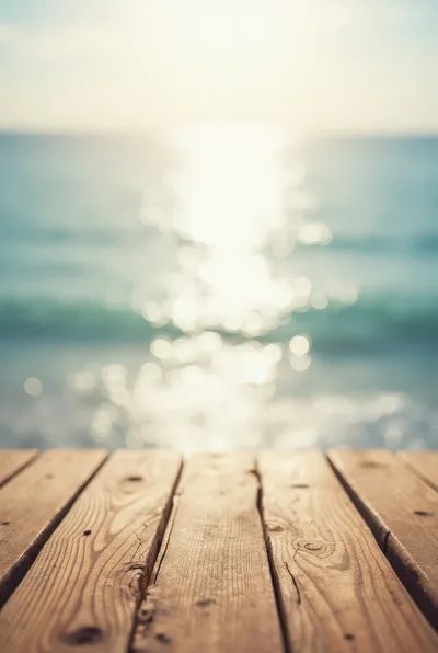 Wooden Pier Overlooking A Blurred Ocean Sunset