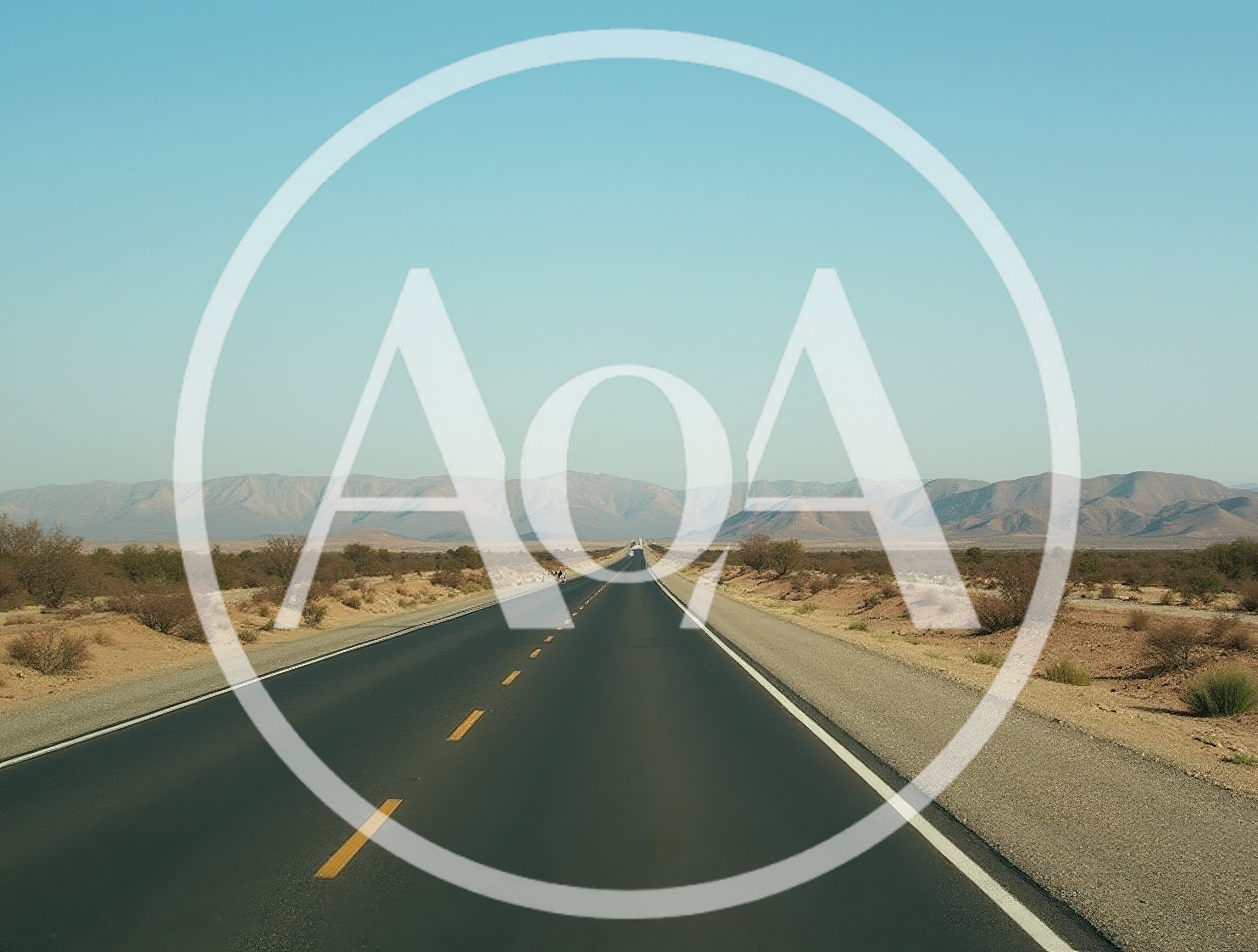 Empty Asphalt Highway Through Arid Desert Landscape