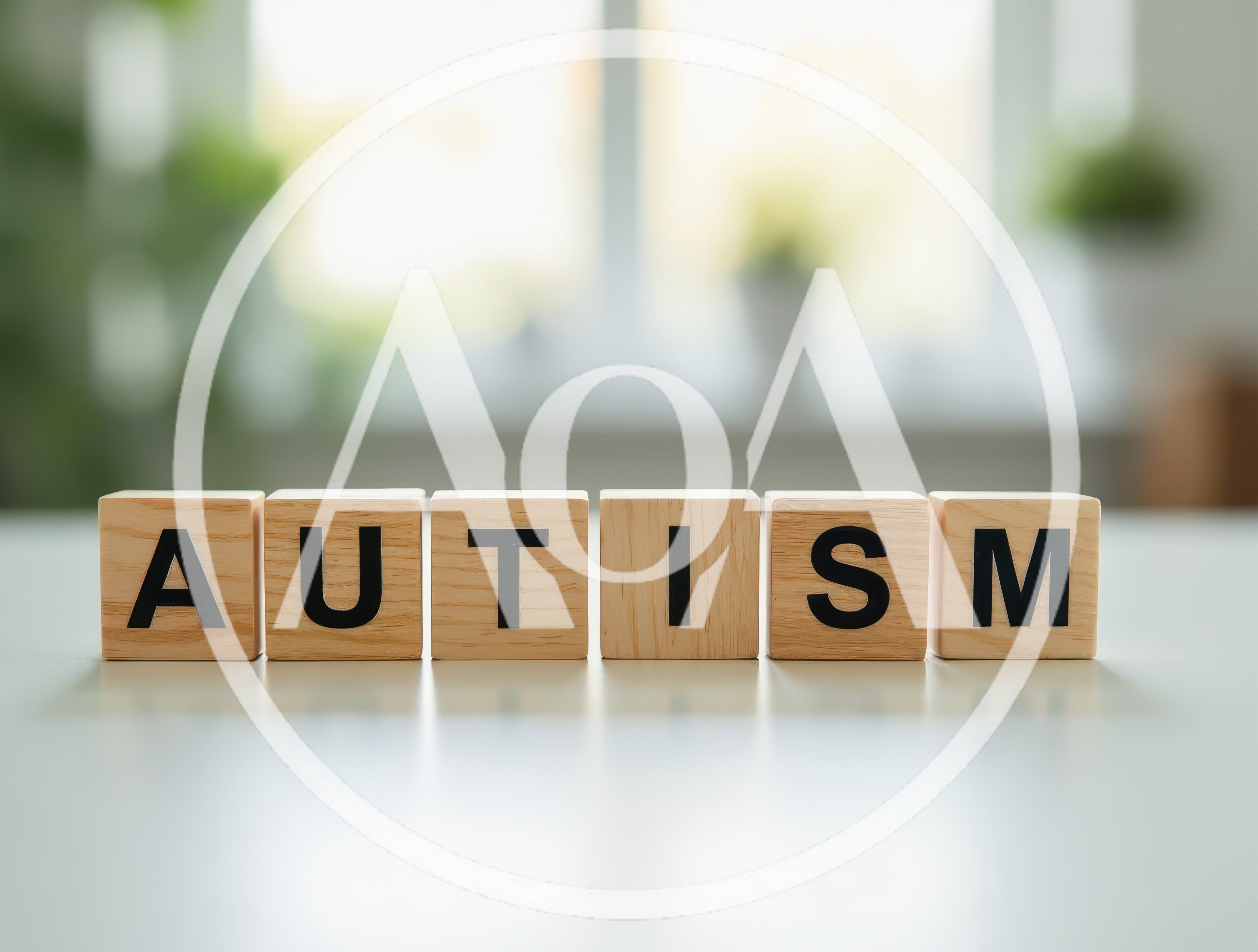 Wooden Blocks Spelling The Word Autism On A Table
