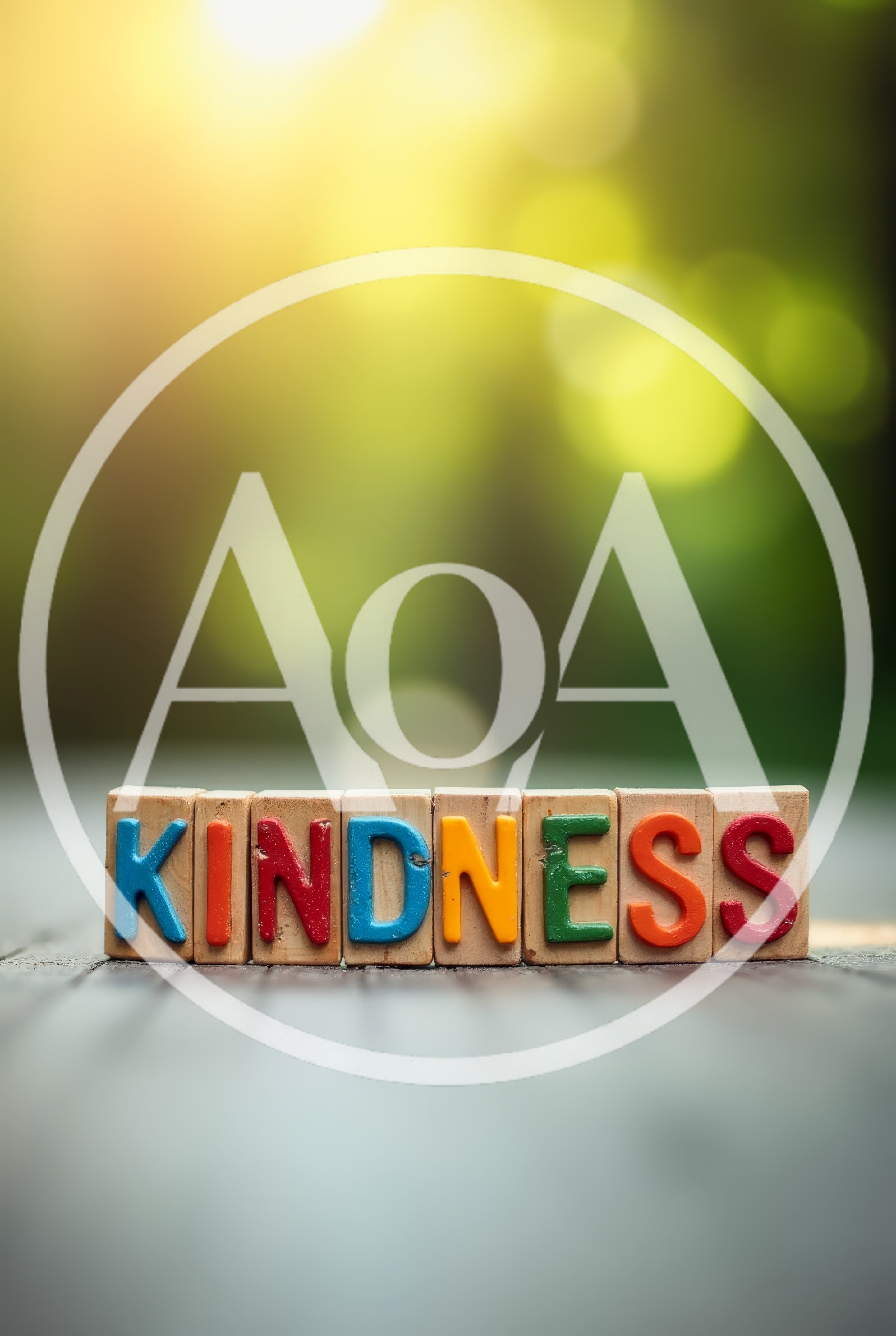 Wooden Blocks Spelling Kindness On A Blurred Nature Background