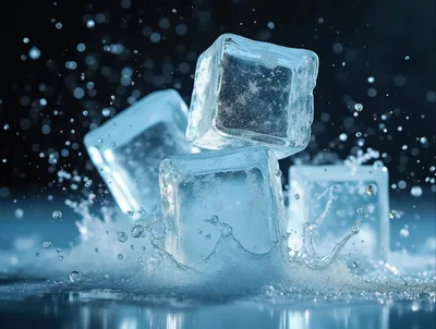 Three Ice Cubes Splashing Into Water