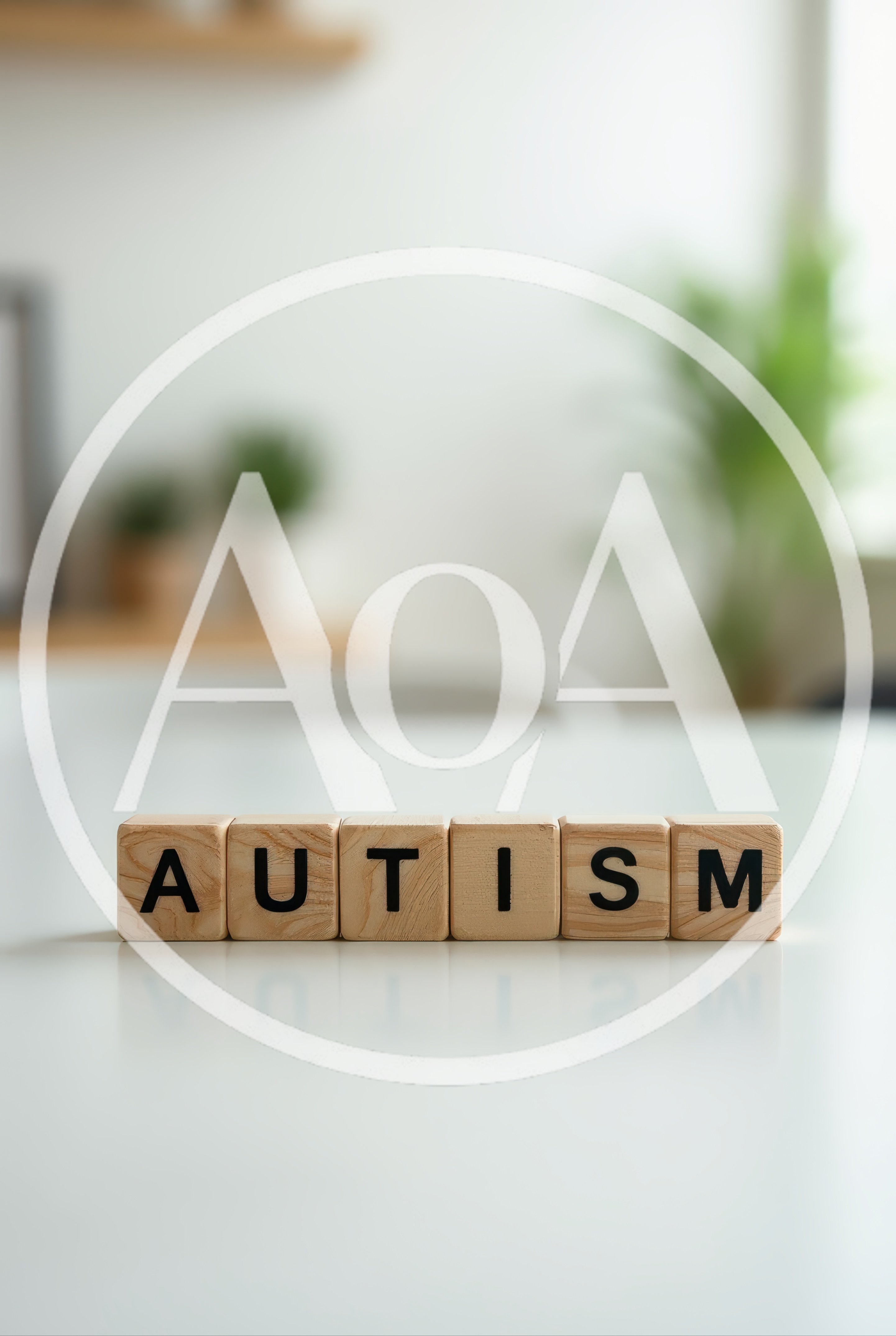 Wooden Blocks Spelling Autism on White Table