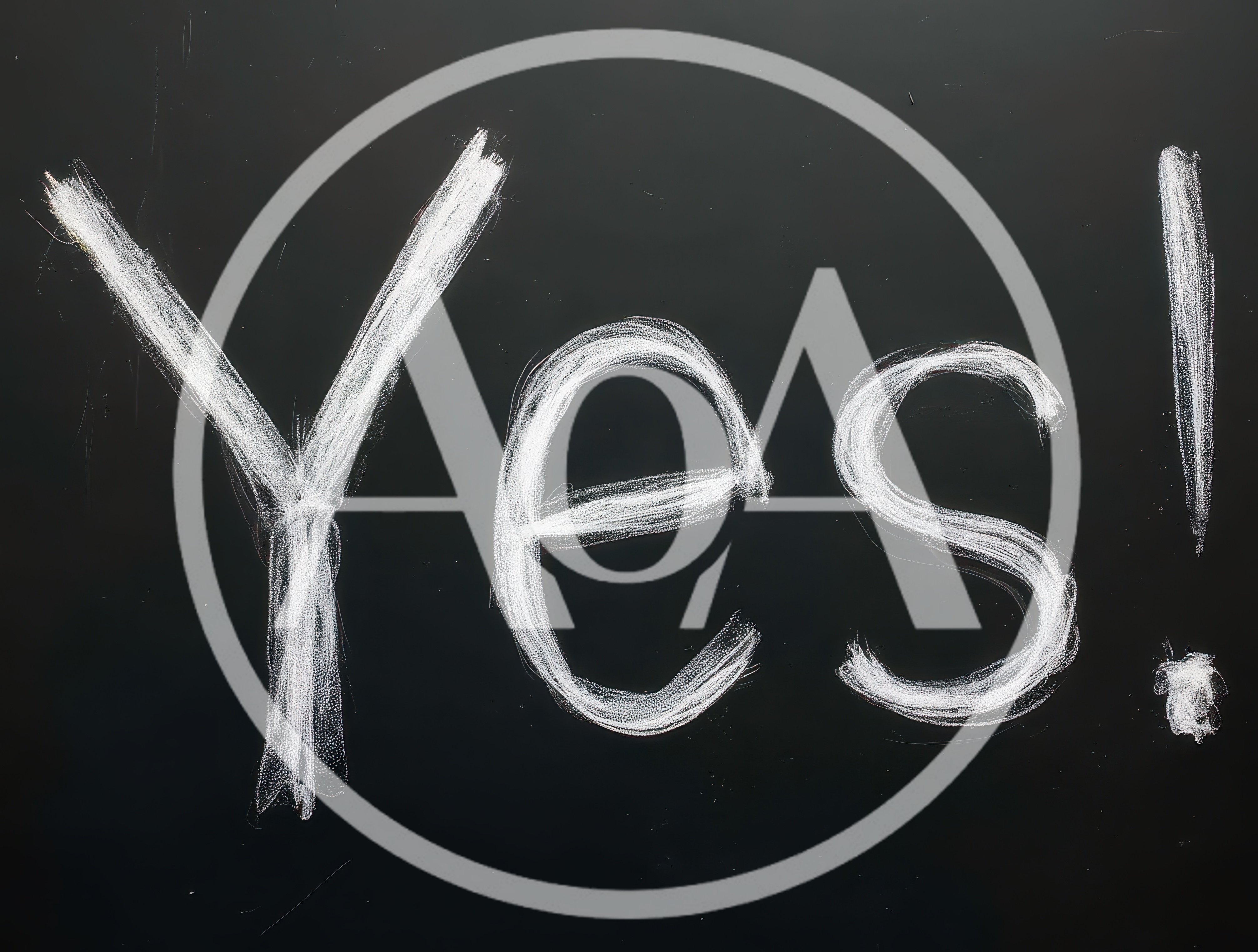 Yes Written In White Chalk On A Black Blackboard