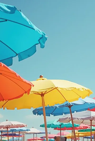Colorful Beach Umbrellas Under A Clear Blue Sky