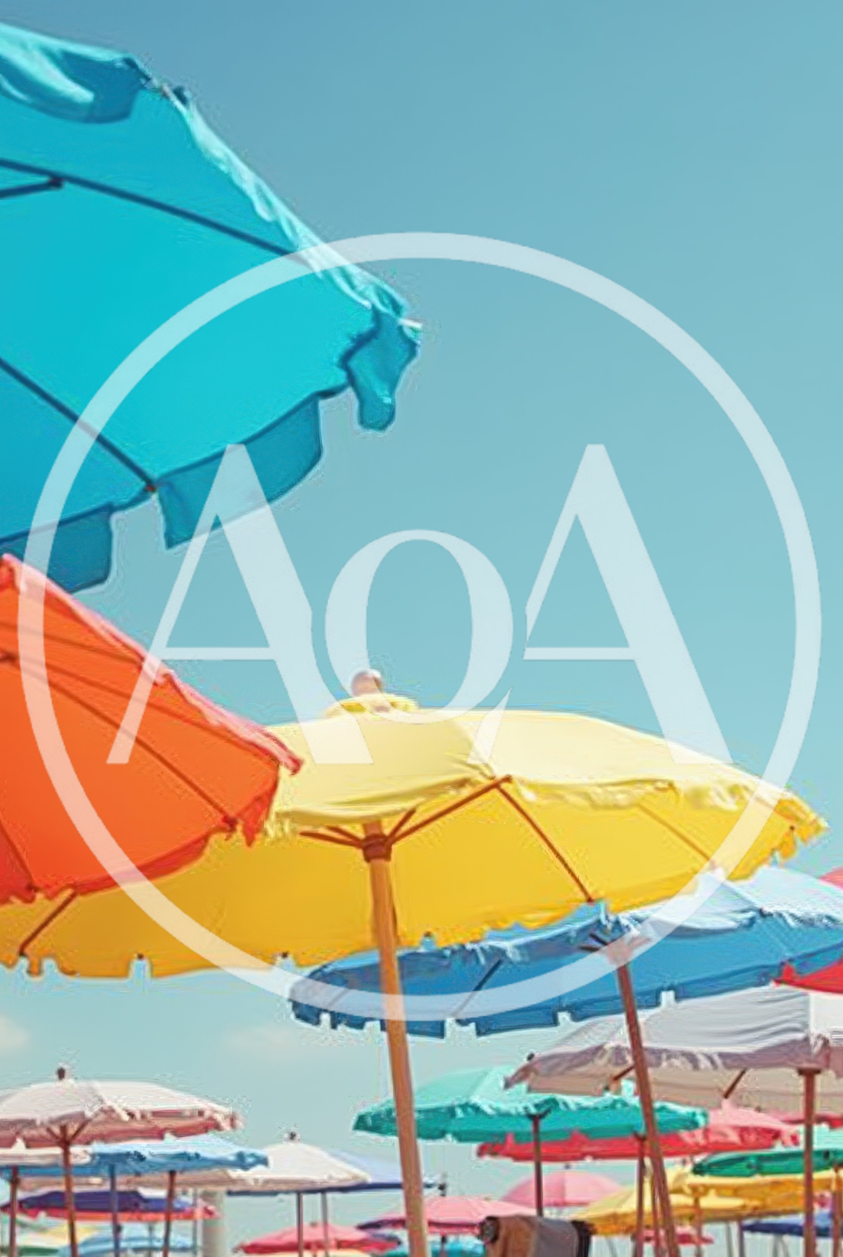 Colorful Beach Umbrellas Under A Clear Blue Sky